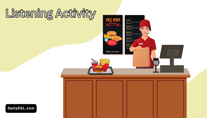 Fast food worker behind a counter holding a bag of food.